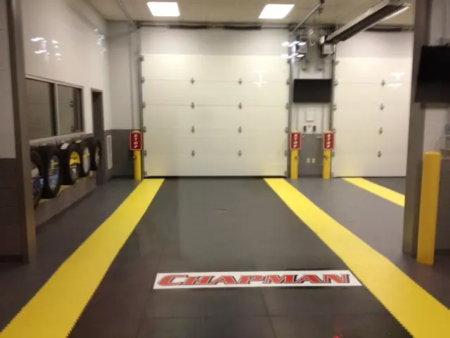 A garage with yellow and black flooring