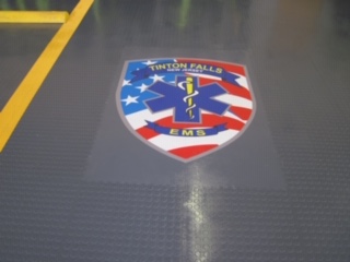 A close up of the star spangled banner on the floor.