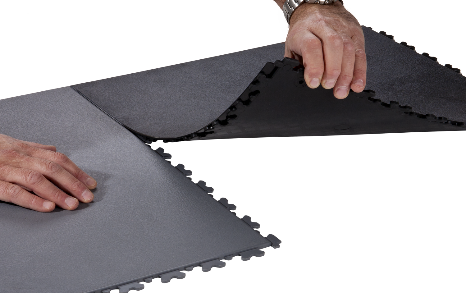 A person is holding onto the edge of a mat.