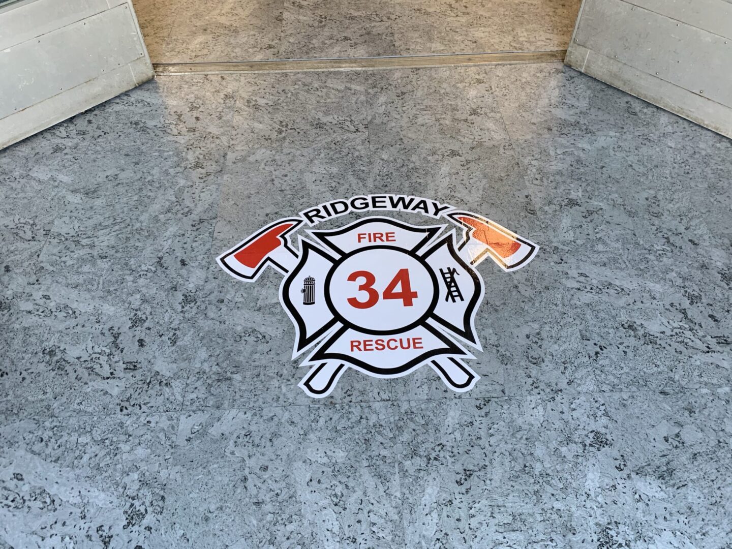 A fire department logo is shown on the floor.
